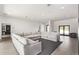 Open living space with a comfortable sectional sofa and access to the outdoors at 9027 N 82Nd St, Scottsdale, AZ 85258