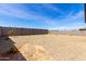 Expansive backyard featuring desert landscaping and a block wall for privacy at 18197 W Cielo Grande Ave, Surprise, AZ 85387