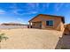 A spacious backyard shows desert landscaping, block wall, and covered patio access at 18197 W Cielo Grande Ave, Surprise, AZ 85387