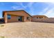 Large backyard shows low-maintenance desert landscaping and privacy wall at 18197 W Cielo Grande Ave, Surprise, AZ 85387