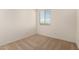 Carpeted bedroom with a window that brings in natural light at 18197 W Cielo Grande Ave, Surprise, AZ 85387
