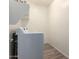 Laundry room featuring modern appliances and practical storage at 18197 W Cielo Grande Ave, Surprise, AZ 85387