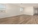 Open-concept living area with tile flooring, neutral paint, and ample natural light from multiple windows at 18197 W Cielo Grande Ave, Surprise, AZ 85387