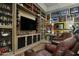 Home gym with built in display shelving for trophies and sports memorabilia at 19481 N 98Th Pl, Scottsdale, AZ 85255