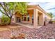 Beautiful backyard featuring a covered patio and desert landscaping with native plants at 17316 N Inca Pl, Surprise, AZ 85374