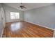 Bright, airy bedroom with vaulted ceiling, ceiling fan and laminate wood floors at 17316 N Inca Pl, Surprise, AZ 85374