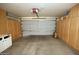 Spacious garage with built-in wooden cabinets for ample storage solutions at 17316 N Inca Pl, Surprise, AZ 85374