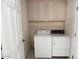 Bright laundry room equipped with a washer, dryer, and ample cabinet space at 17316 N Inca Pl, Surprise, AZ 85374