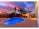 Stunning backyard with a pool, outdoor kitchen, and pergola at 21950 N 100Th Ave, Peoria, AZ 85383