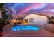 Inviting pool and patio area with a pergola and outdoor kitchen at 21950 N 100Th Ave, Peoria, AZ 85383