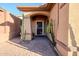 Inviting front entry with security door and desert landscaping at 41515 N Chase Oaks Way, Anthem, AZ 85086