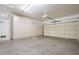 Spacious garage with built-in storage cabinets and overhead racks at 41515 N Chase Oaks Way, Anthem, AZ 85086