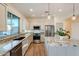 Modern kitchen with granite countertops and island at 41515 N Chase Oaks Way, Anthem, AZ 85086