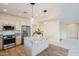 Modern kitchen with granite island and stainless steel appliances at 41515 N Chase Oaks Way, Anthem, AZ 85086