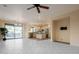 Open living room with tile floors and views to the backyard at 41515 N Chase Oaks Way, Anthem, AZ 85086