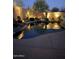 Stunning illuminated pool at night with desert landscaping at 41515 N Chase Oaks Way, Anthem, AZ 85086