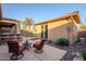 Relaxing patio with seating and views of the pool at 41515 N Chase Oaks Way, Anthem, AZ 85086