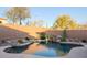 Inviting kidney shaped pool with waterfall feature at 41515 N Chase Oaks Way, Anthem, AZ 85086