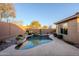 Enjoy this kidney-shaped pool with a tranquil desert landscape at 41515 N Chase Oaks Way, Anthem, AZ 85086