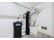 Home utility room with water softener and water heater at 41515 N Chase Oaks Way, Anthem, AZ 85086