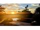 Stunning sunset view from the pool area with palm trees and beautiful sky at 4836 E White Gates Dr, Phoenix, AZ 85018