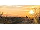 Golden sunset over the city skyline and distant mountains, creating a serene backdrop at 4836 E White Gates Dr, Phoenix, AZ 85018