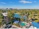 Beautiful aerial view of the community pool and surrounding area with mature landscaping and palm trees at 5122 N 31St Way # 244, Phoenix, AZ 85016