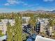 Scenic aerial view showcasing the community buildings, surrounding golf course, and mountain views at 5122 N 31St Way # 244, Phoenix, AZ 85016