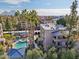 Aerial view of community pool and surrounding buildings with mature landscaping and palm trees at 5122 N 31St Way # 244, Phoenix, AZ 85016