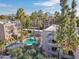 Aerial view of community pool and surrounding buildings with mature landscaping and palm trees at 5122 N 31St Way # 244, Phoenix, AZ 85016