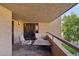 Cozy outdoor balcony with comfortable seating and a small table at 5122 N 31St Way # 244, Phoenix, AZ 85016