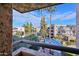 Relax on the balcony with views of palm trees, blue skies, and community landscaping at 5122 N 31St Way # 244, Phoenix, AZ 85016