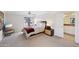 Bedroom featuring neutral color palette, ceiling fan, and large window at 5122 N 31St Way # 244, Phoenix, AZ 85016