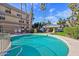Enjoy the sparkling community pool with a spa, seating and lush landscaping at 5122 N 31St Way # 244, Phoenix, AZ 85016