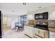 Eat-in kitchen with stainless steel appliances and adjacent dining area with natural light at 5122 N 31St Way # 244, Phoenix, AZ 85016