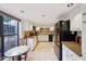 Kitchen with granite countertops, modern appliances, tile backsplash, and tile floor at 5122 N 31St Way # 244, Phoenix, AZ 85016