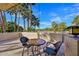 Relax on the patio with seating, offering views of palm trees and a nearby golf course at 5122 N 31St Way # 244, Phoenix, AZ 85016