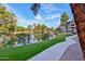 Scenic view of a pond, trees, and the building, creating a serene outdoor environment at 5122 N 31St Way # 244, Phoenix, AZ 85016