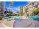 Community pool area features a spa, pool, and lounge chairs for relaxing in the sun at 5122 N 31St Way # 244, Phoenix, AZ 85016