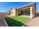 Private backyard with covered patio, artificial turf, and gravel at 4287 E Clifton Ave, Gilbert, AZ 85295