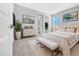 Serene bedroom with a plush bed, stylish bench, and contemporary decor, creating a relaxing retreat at 5616 W Paseo Way, Laveen, AZ 85339