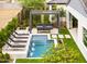 Aerial view of pool featuring lounge chairs, waterfall features, and a pergola-covered seating area at 1427 E Cherrywood Pl, Chandler, AZ 85249