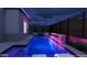 Night view of a modern pool and spa with colorful LED lighting at 3473 W Mountain Vista Dr, Phoenix, AZ 85045