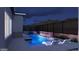 Night view of a luxurious pool and spa with ambient lighting at 3473 W Mountain Vista Dr, Phoenix, AZ 85045