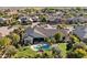Beautiful aerial view of home with pool, lush landscaping, patio, and fire pit in a desirable neighborhood at 2086 E Mead Dr, Gilbert, AZ 85298