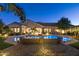 Luxury home with a large pool, fire pit, and outdoor kitchen at 2086 E Mead Dr, Gilbert, AZ 85298