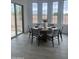 Bright dining area featuring a wood table and six chairs next to sliding glass door at 1130 E Peach Tree Dr, Chandler, AZ 85249