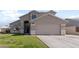 Two-story house with attached garage and well-maintained lawn at 1207 N Velero St, Chandler, AZ 85225