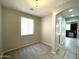 Dining area with carpet and view of kitchen at 17323 W Woodlands Ave, Goodyear, AZ 85338