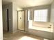 Bathroom with shower and bathtub, and tiled floor at 17323 W Woodlands Ave, Goodyear, AZ 85338